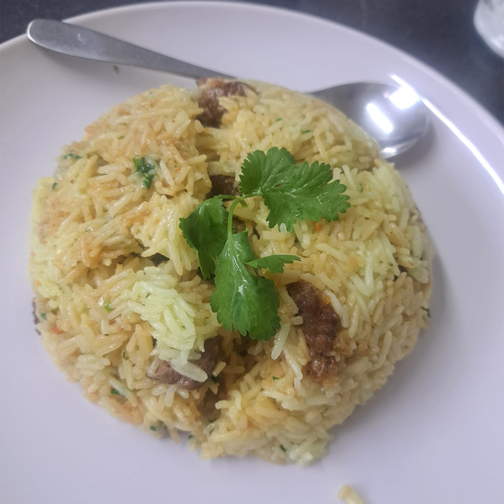 Rice pilaf with beef and fresh coriander